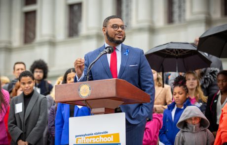 Lieutenant Governor Austin Davis smiling and speaking to attendees on Capitol steps during 2023 Afterschool Advocacy Rally